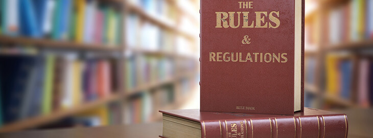 Rules and Regulations books on table in a library