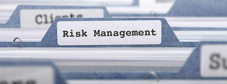 file folders with focus on Risk Management