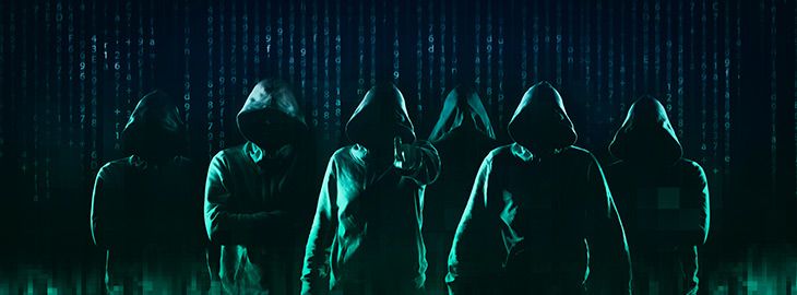 army of hackers standing in front of a wall of binary code